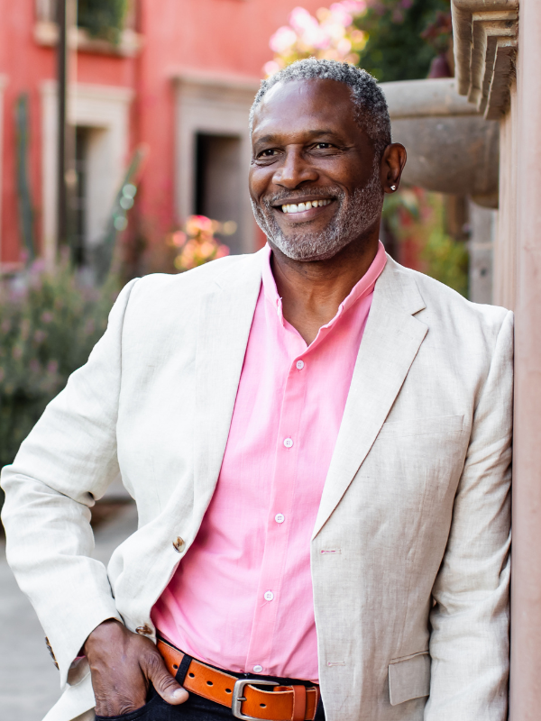 Kenneth G Alexander smiles radiantly, his joy shows he lives a heart-based life. Business consultant, author, and producer.