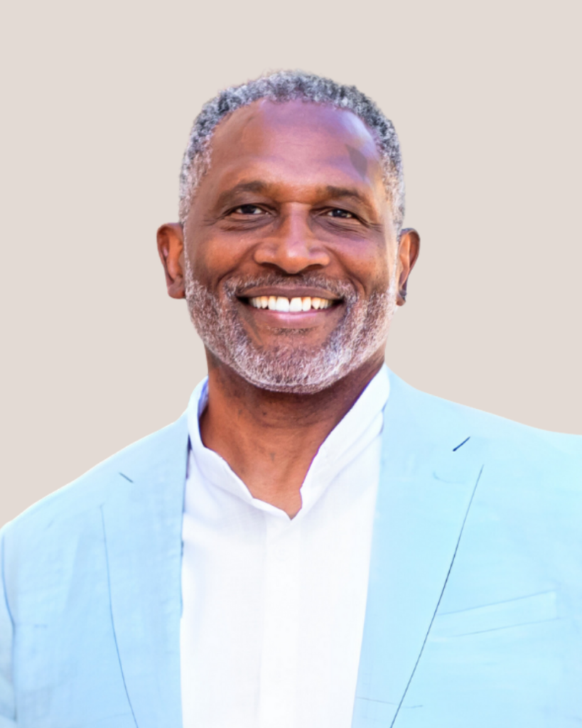 Kenneth G Alexander against a light taupe background